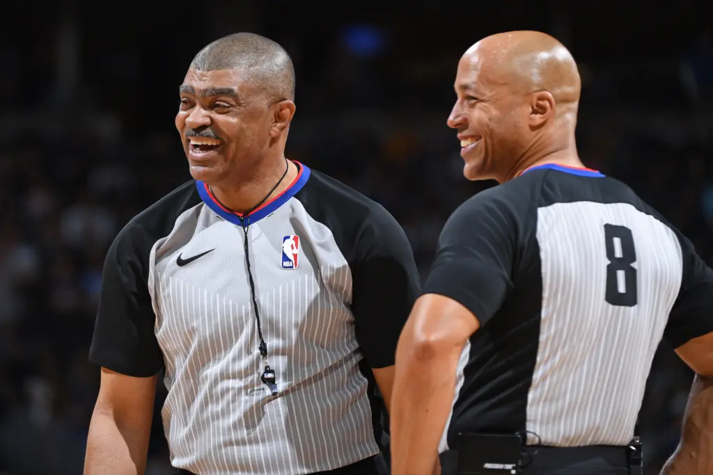 NBA refs Tony brothers and Marc Davis smiling