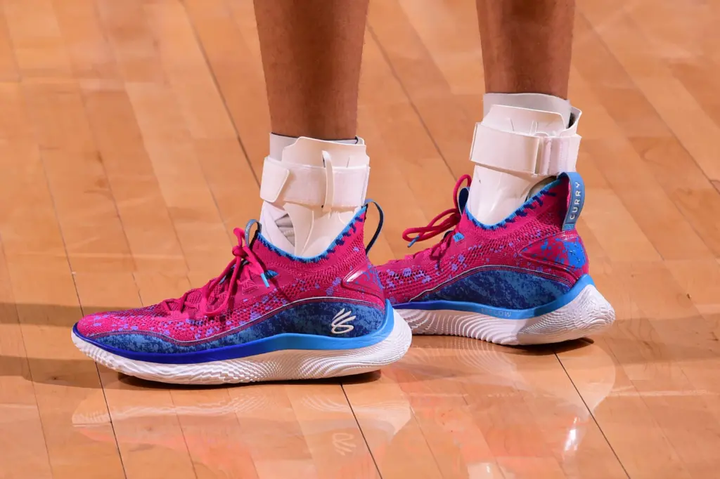closeup of steph curry's shoes, socks, and ankle braces